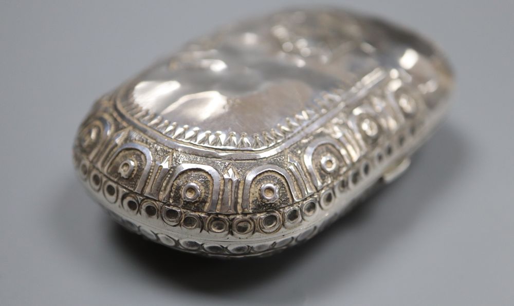 A Victorian silver mounted ovoid purse, decorated with Greek busts, Levy & Salaman, Birmingham, 1884, 72mm.